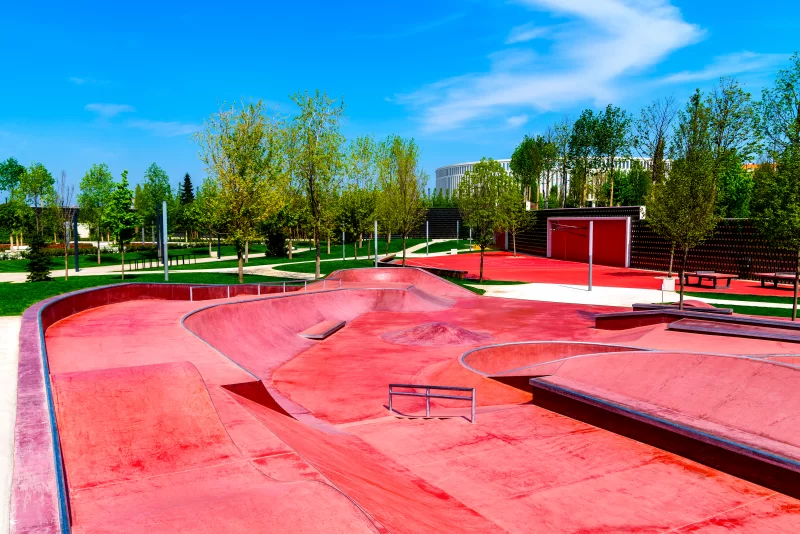 Red skate, roller and bike park with tubes, springboard and jumps