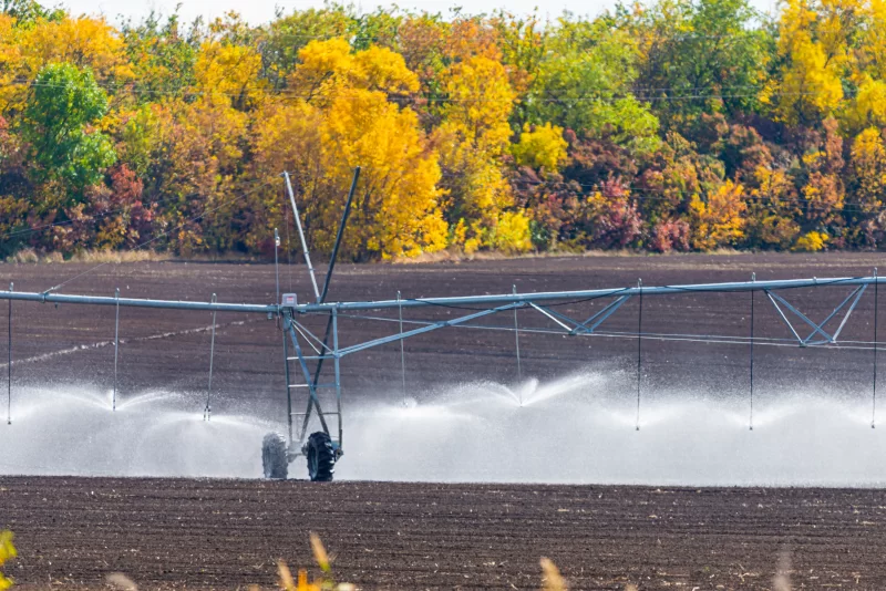 Modern irrigation system watering a farm field