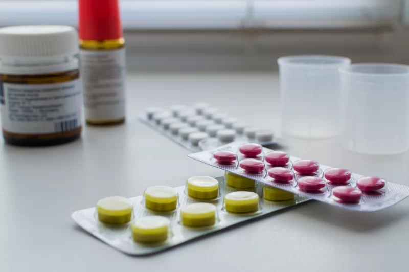 Medical supplies and pills on a white background