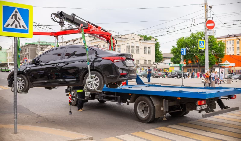 Car towed for parking violation by traffic police