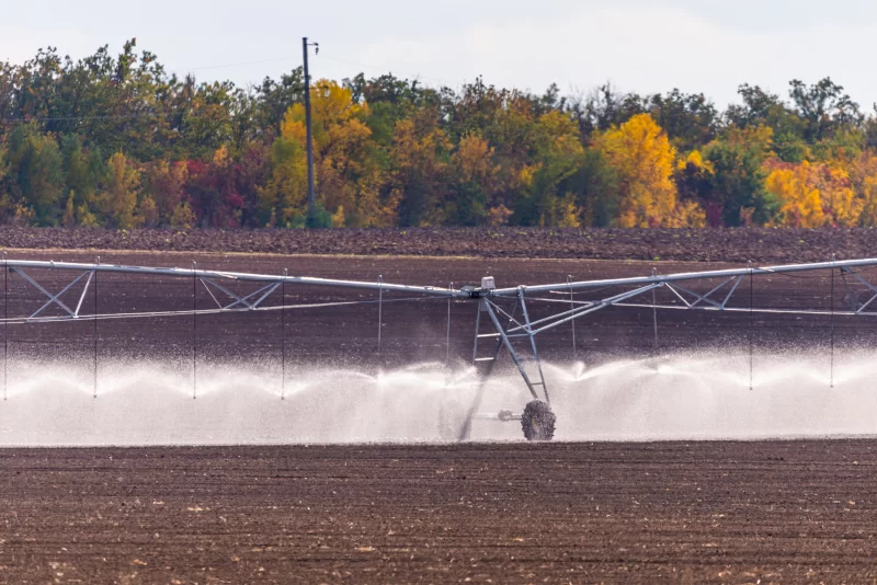 Modern irrigation system watering a farm field