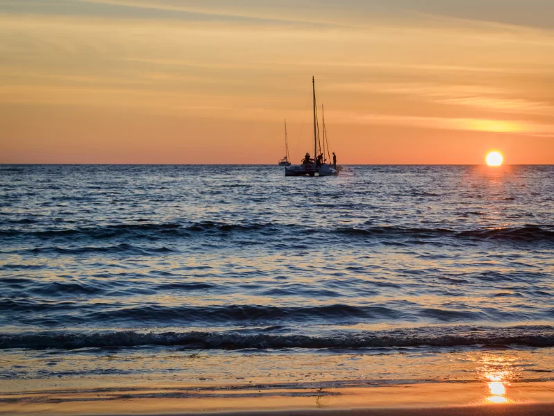 Sailing boats on the sea at sunset.