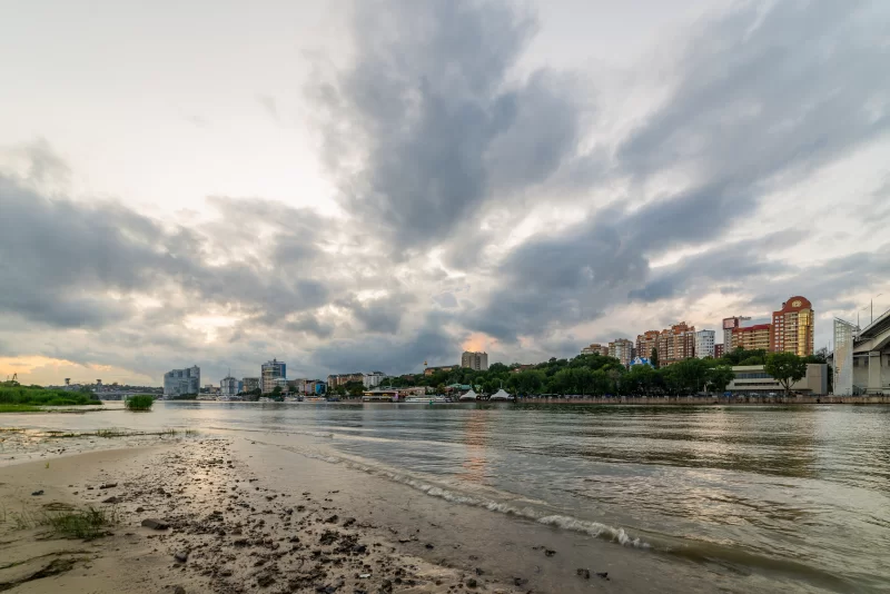 River Landscape with Urban View