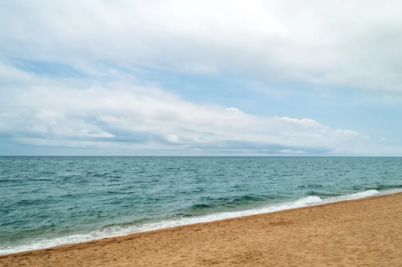 Mediterranean sea coast under cloudy sky