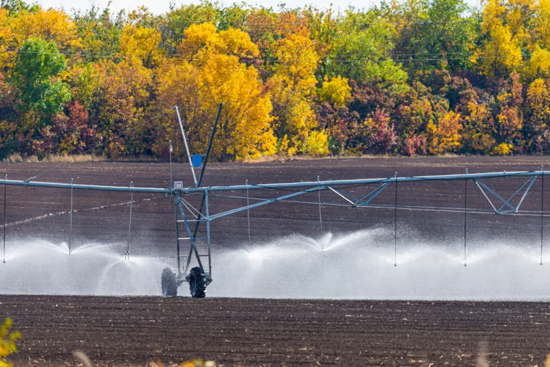 Modern irrigation system watering a farm field
