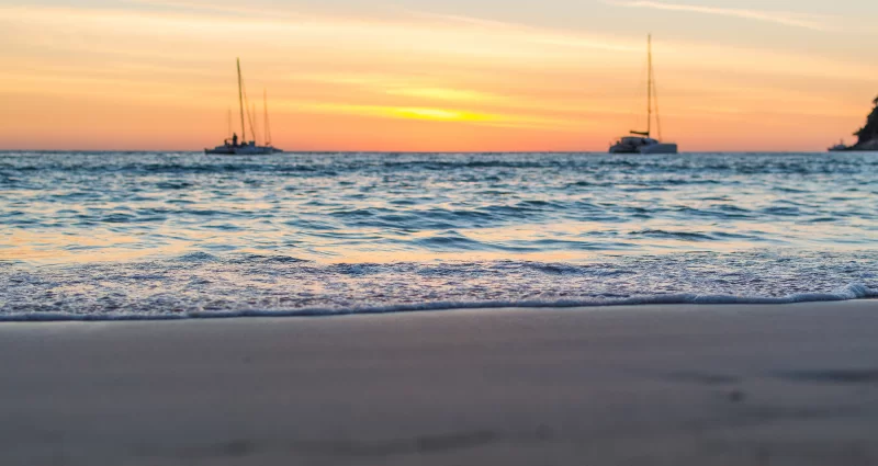 Soft waves on the sand at sunset