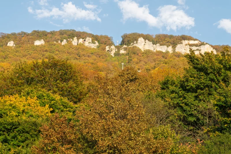 Adygea autumn forest with white rock cliffs