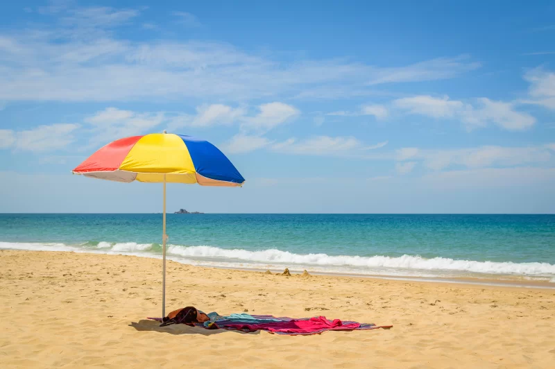 Colorful beach umbrella on the sandy beach