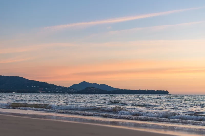 Soft waves on the sand at sunset