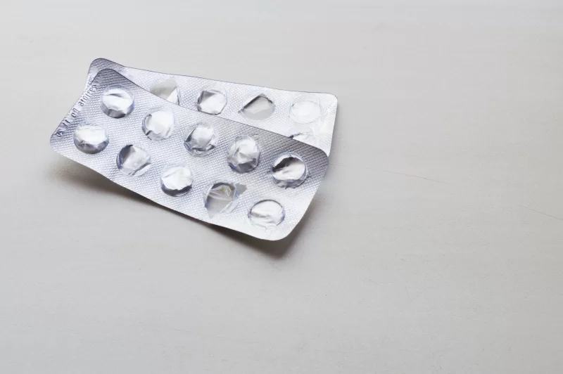 Empty pill blister pack on a neutral background